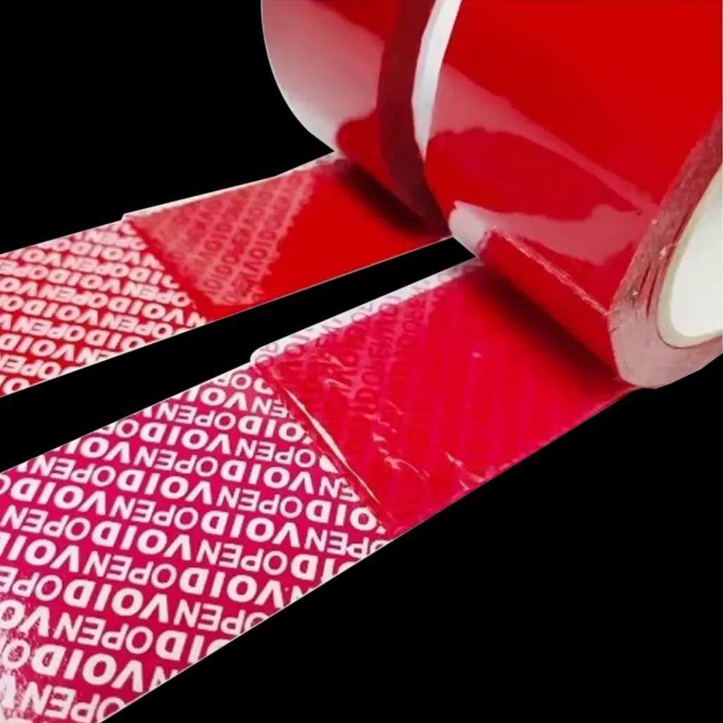 Red tamper evident tape roll showing hidden OPEN VOID reveal