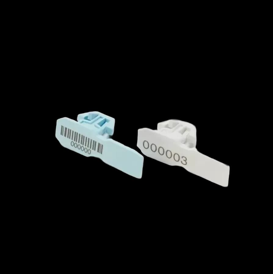 TRTOTE_1 white and pastel blue security seals for tote bins, printed with serial number and barcode, side-angled view.
