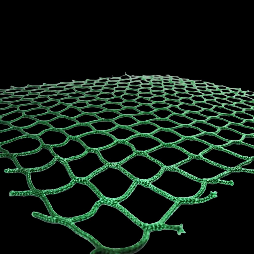 Close-up perspective of green pallet cargo net mesh pattern